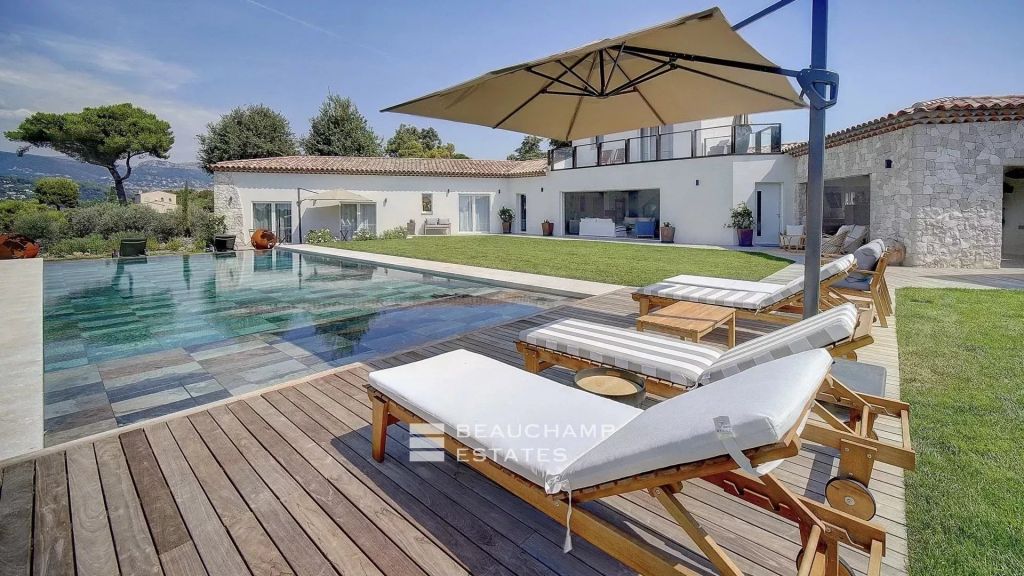 Contemporary 4-bedroom villa nestled in the hills of Saint-Paul-de-Vence with tennis court, swimming pool, and sauna