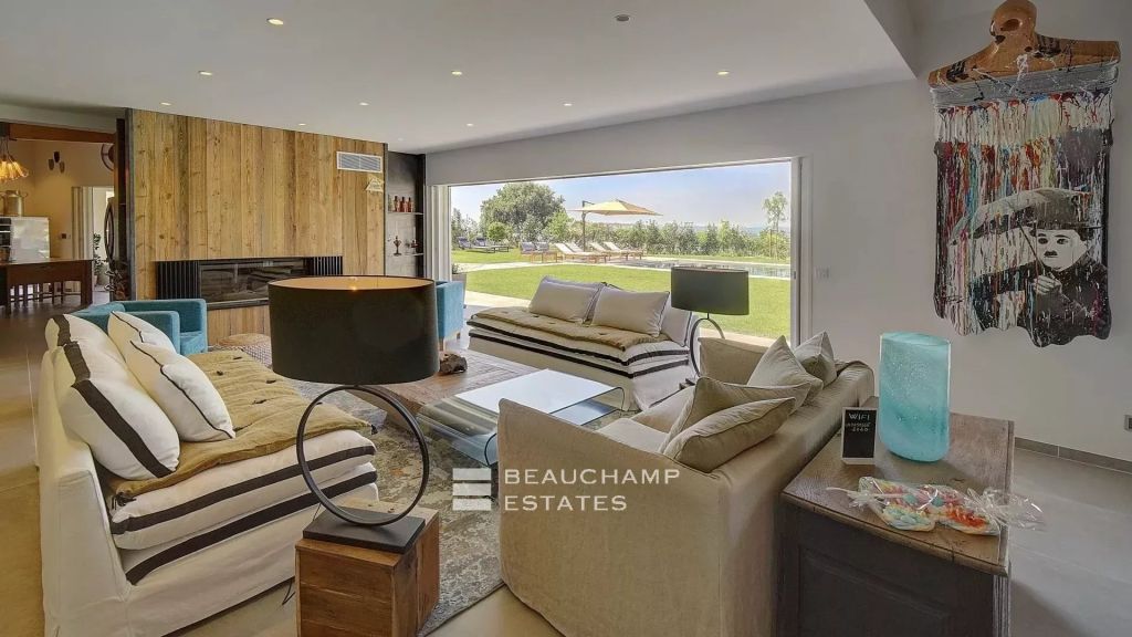 Contemporary 4-bedroom villa nestled in the hills of Saint-Paul-de-Vence with tennis court, swimming pool, and sauna