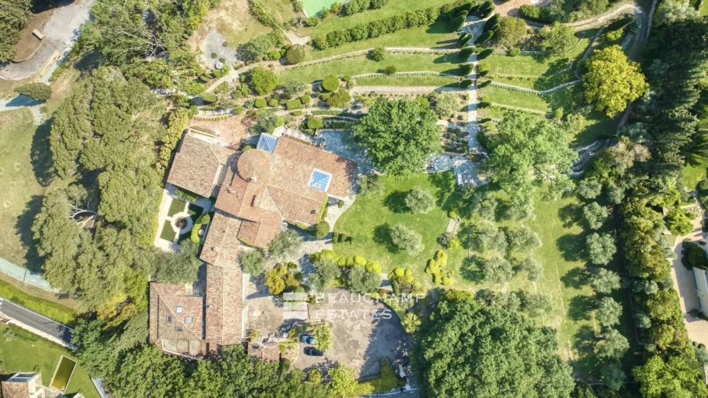 Exceptional domain with 11 bedrooms within walking distance of the village of Mougins, featuring tennis court, pool, and breathtaking sea view