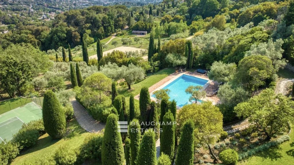 Exceptional domain with 11 bedrooms within walking distance of the village of Mougins, featuring tennis court, pool, and breathtaking sea view