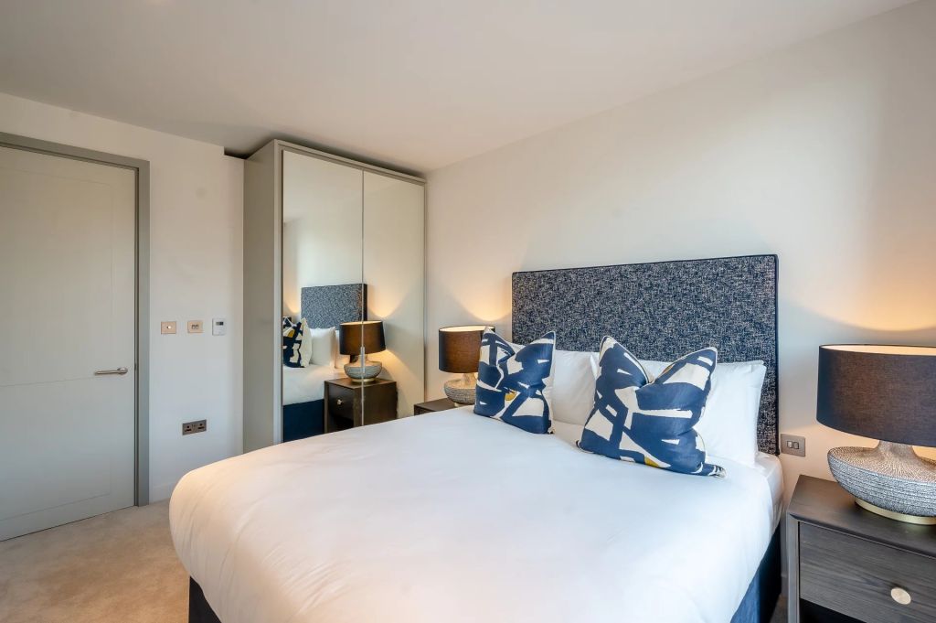 A contemporary two-bedroom, second-floor apartment in a newly built mansion block.