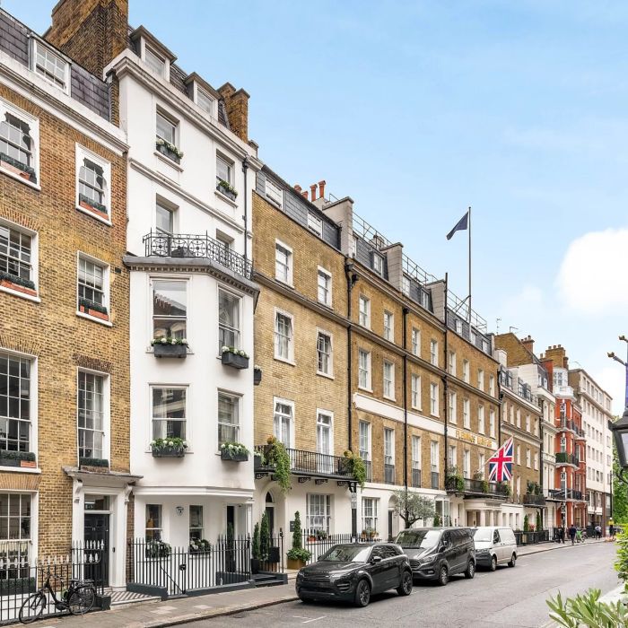 An exceptional townhouse with a cinema, lift and a private roof terrace, situated in the heart of Mayfair moments from Green Park.