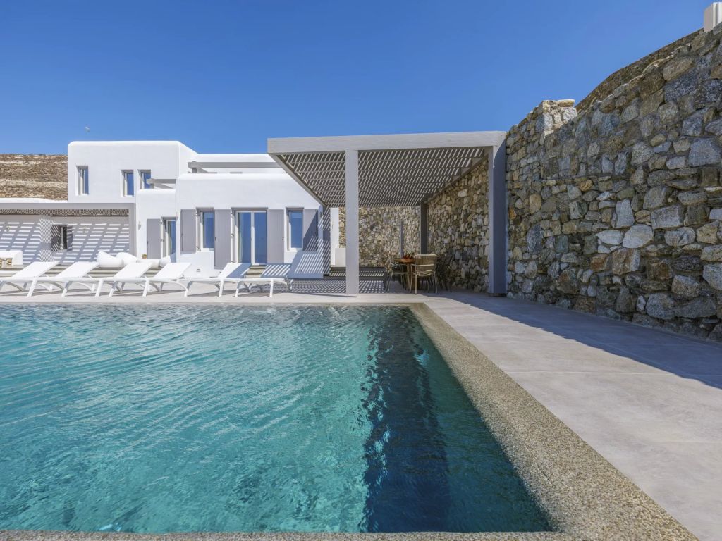 Villa Amare IV | An idyllic escape with panoramic sea vistas and direct access to a private beach.