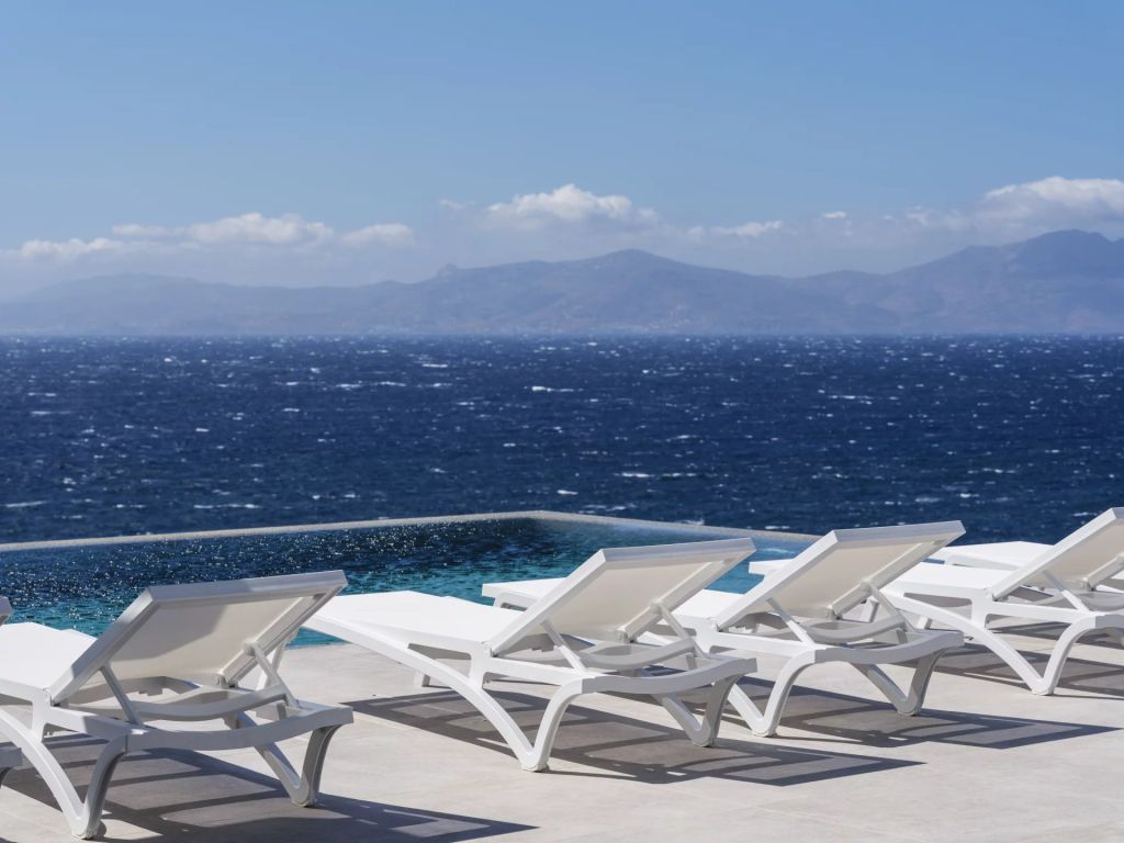 Villa Amare IV | An idyllic escape with panoramic sea vistas and direct access to a private beach.