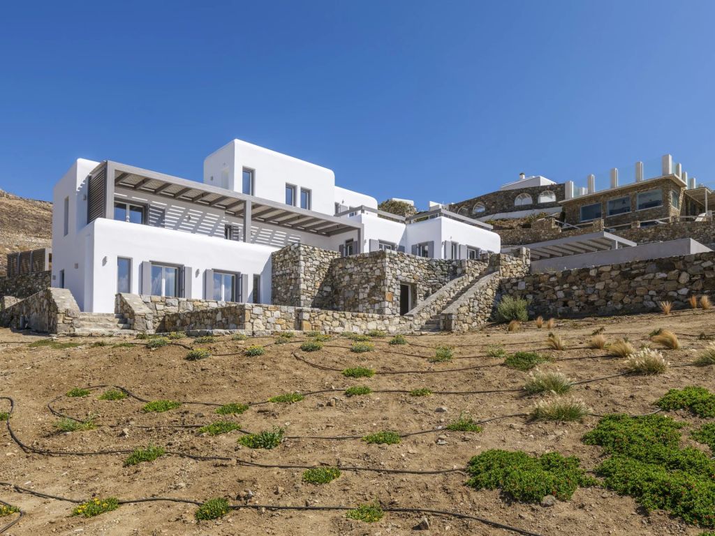 Villa Amare IV | An idyllic escape with panoramic sea vistas and direct access to a private beach.